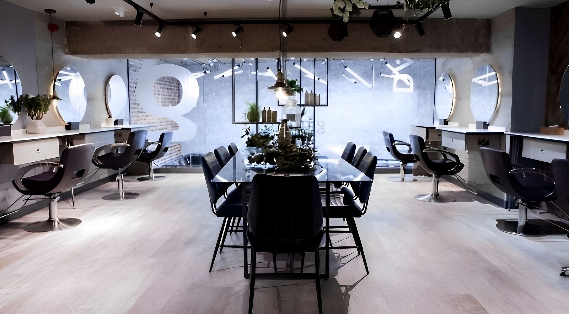 Chic interior of Gina Conway Beauty in London, England, GB showcasing stylish workstations and elegant decor.