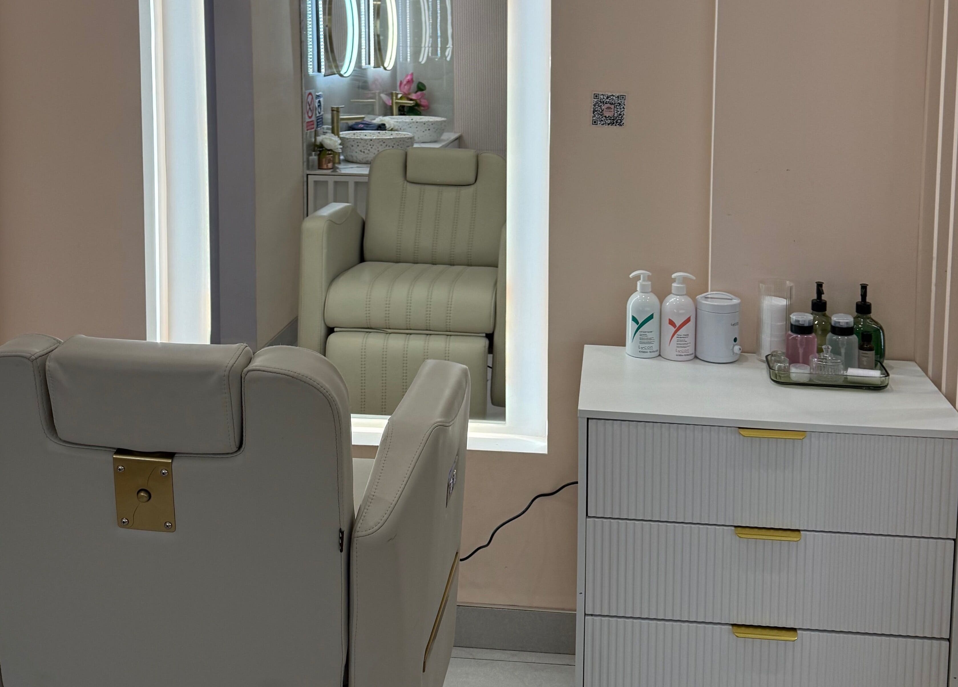 Cozy salon chair with beauty products at 107 Putney high street SW15 1SS, London, England, GB.