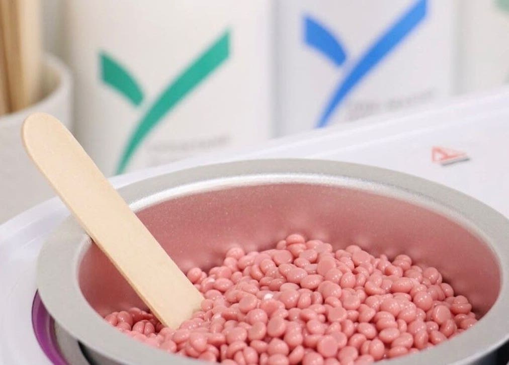 Pink wax beans in a warmer at 107 Putney high street SW15 1SS, London, England, GB beauty venue.