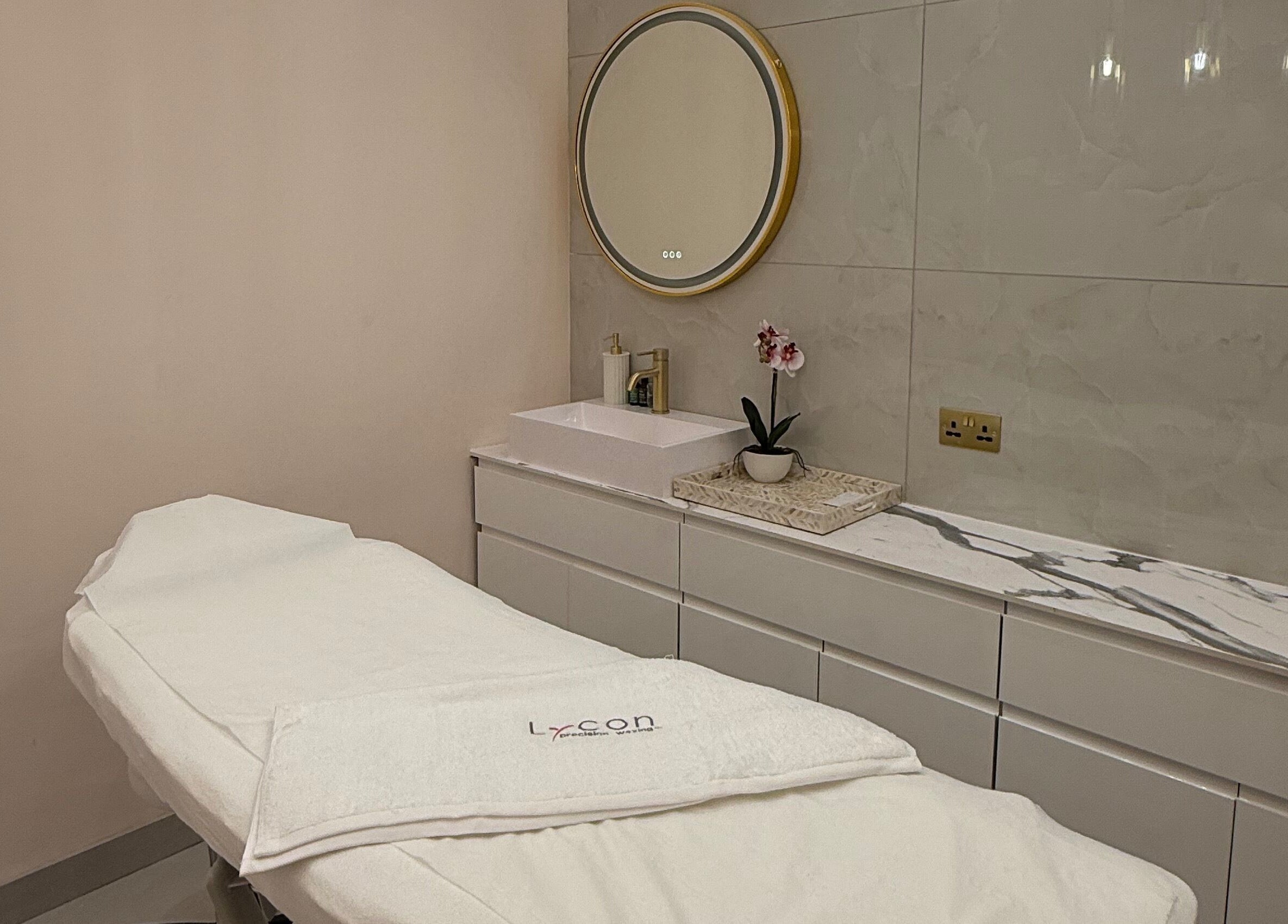 Serene spa room at 107 Putney High Street SW15 1SS, London, England, GB with elegant decor and a massage table.