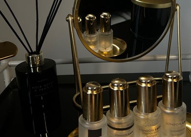 Elegant vanity setup at De Luxe Beaute, Nottingham, England, GB with luxury beauty products and mirror.