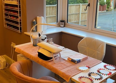 Nail station at Nu Nails And Beauty in Hemel Hempstead, England, GB, showcasing tools and polish selection.