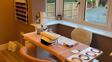 Nail station at Nu Nails And Beauty in Hemel Hempstead, England, GB, showcasing tools and polish selection.