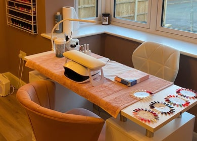 Chic nail station at Nu Nails And Beauty, Hemel Hempstead, England, GB, with gel polish samples.