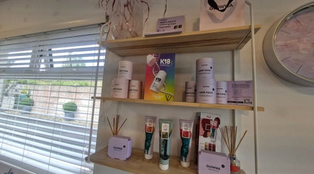 Product display at Hairbyanna, Limerick, County Clare, IE, featuring Glowwa hair care items on shelf.