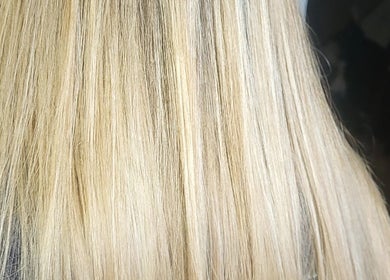 Blonde hair styled beautifully at Hairbyanna, Limerick, County Clare, IE, showcasing smooth, shiny locks.