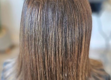 Glossy brown hair treatment at Hairbyanna in Limerick, County Clare, IE, showcasing healthy shine.