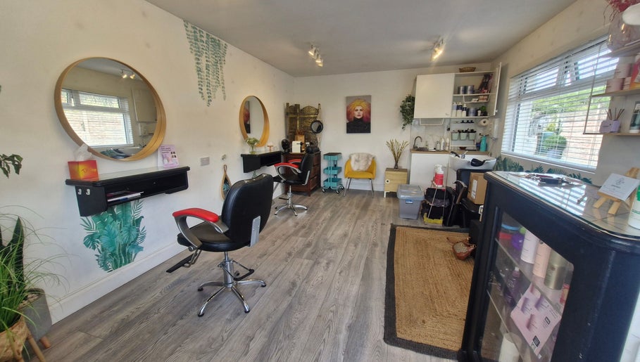 Interior of Hairbyanna in Limerick, County Clare, IE showcasing modern salon setup with styling chairs and decor.