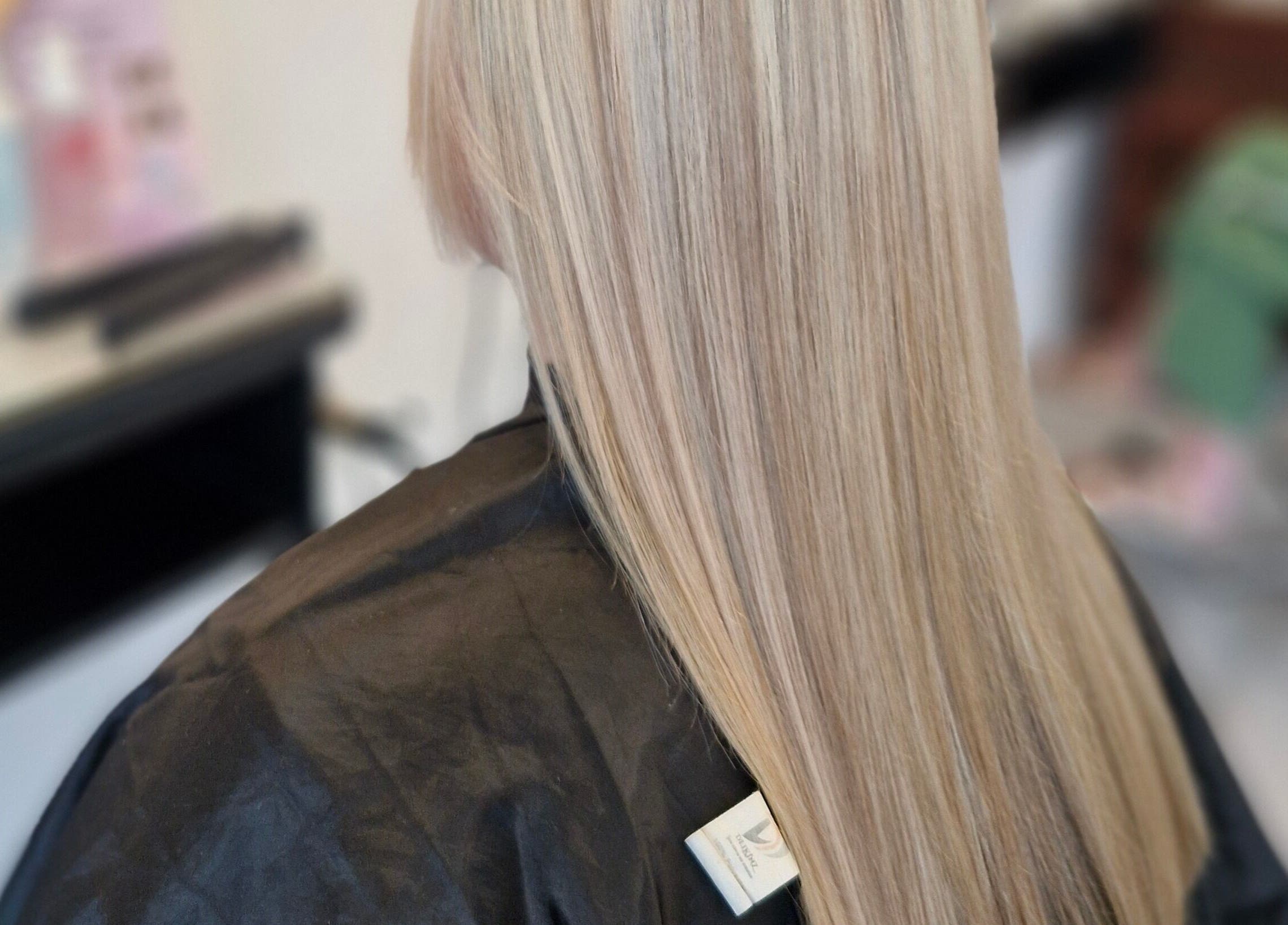 Sleek, straight blonde hair styled at HairbyAnna, County Clare, County Clare, IE salon.
