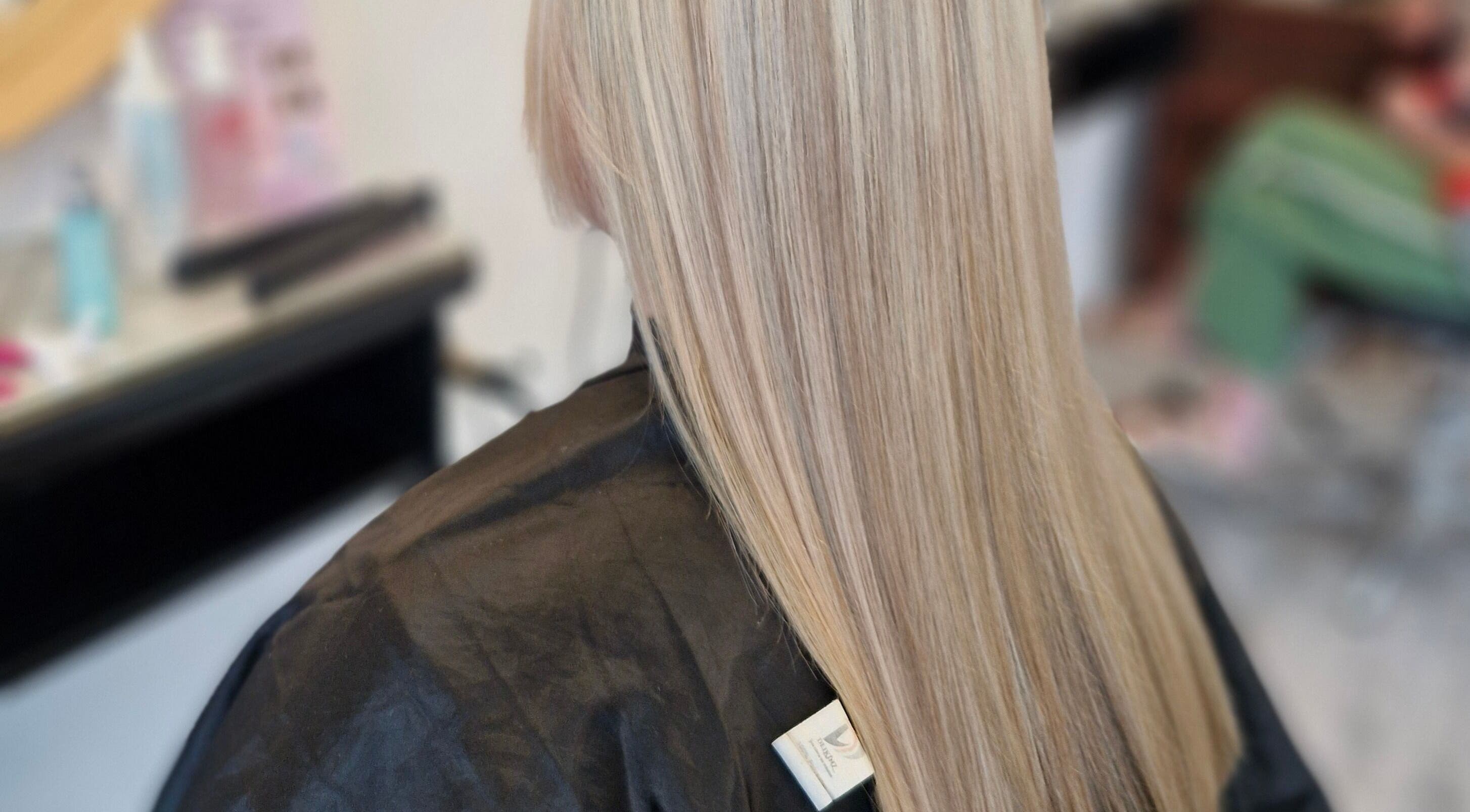 Sleek, straight blonde hair styled at HairbyAnna, County Clare, County Clare, IE salon.