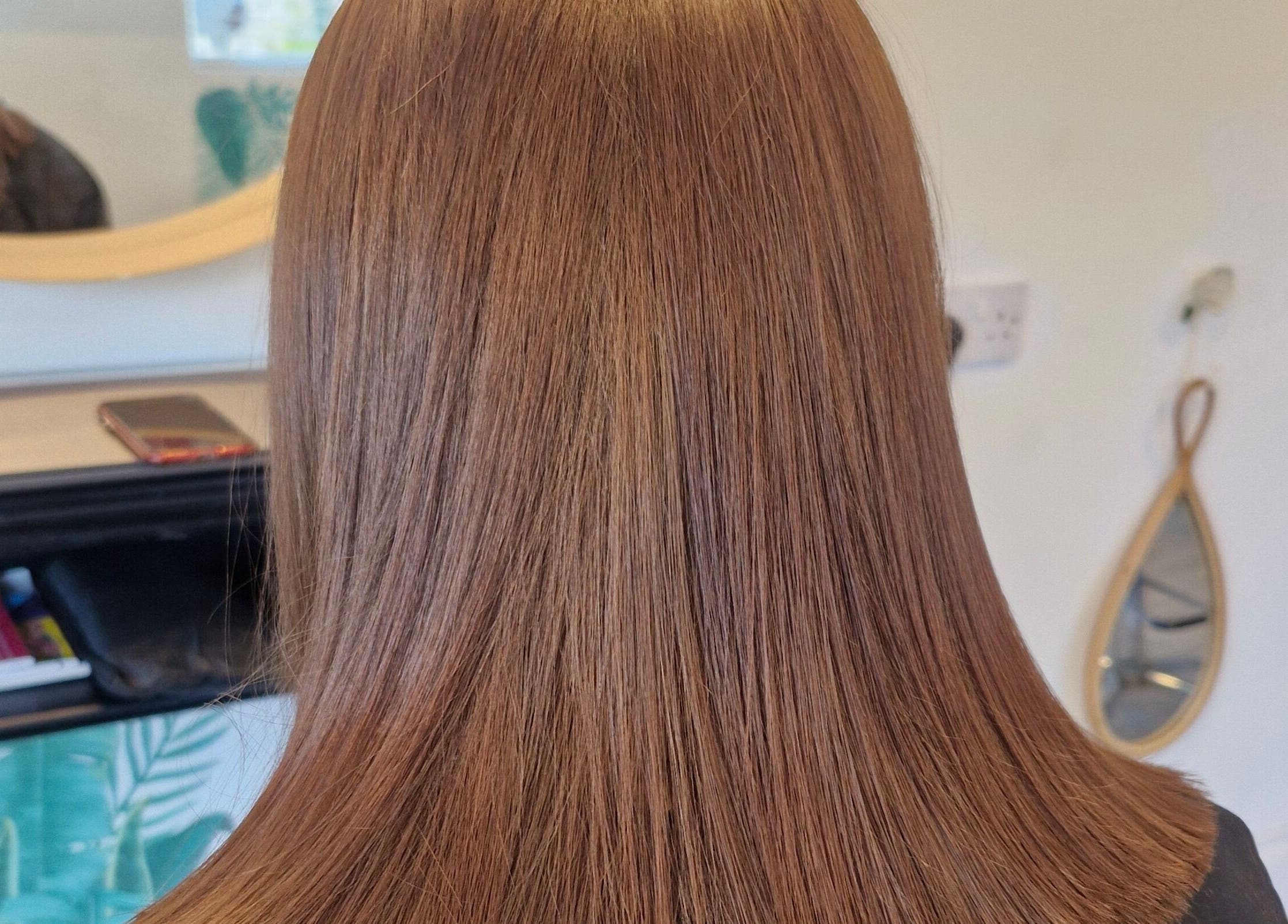 Glossy brown hair styled sleek at HairbyAnna, County Clare, County Clare, IE in a chic salon setting.