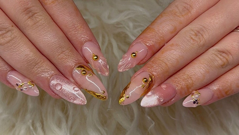 Intricate gold-accented nail art at Leila Tunno Nails, Windsor Gardens, South Australia, AU.