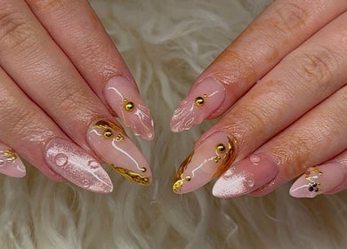 Intricate gold-accented nail art at Leila Tunno Nails, Windsor Gardens, South Australia, AU.