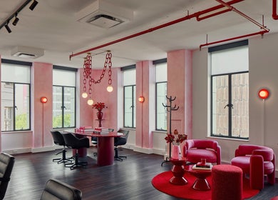 Spacious, stylish interior of Ginger Rose in Melbourne, Victoria, AU with modern decor and vibrant red accents.