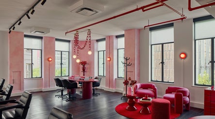 Spacious, stylish interior of Ginger Rose in Melbourne, Victoria, AU with modern decor and vibrant red accents.