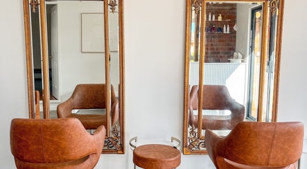 Elegant salon chairs and mirrors at Renz Hair Studio in Melbourne, Victoria, AU.