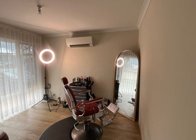 Cozy barber chair setup at B The Barber, Perth, Western Australia, AU, featuring modern studio lighting.