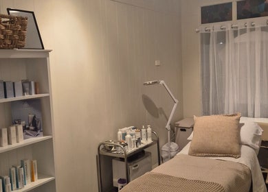 Relaxing treatment room at SK Dermal, Romsey, Victoria, AU with soothing decor and skincare products.