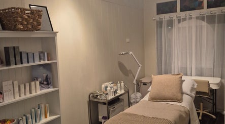 Relaxing treatment room at SK Dermal, Romsey, Victoria, AU with soothing decor and skincare products.