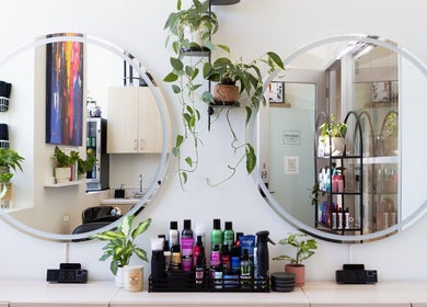 Modern salon with plants and beauty products at Hidden Gem Hair by Marie-Eve Faucher, Toronto, Ontario, CA.