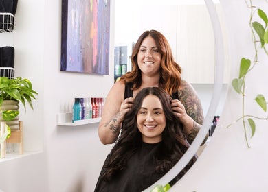 Stylist at Hidden Gem Hair by Marie-Eve Faucher in Toronto, Ontario, CA creates a stunning hairstyle for a client.
