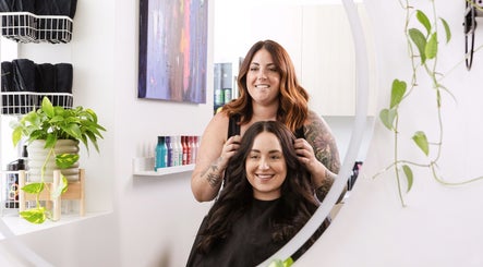 Stylist at Hidden Gem Hair by Marie-Eve Faucher in Toronto, Ontario, CA creates a stunning hairstyle for a client.