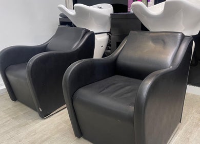 Comfortable salon wash chairs at Dreams Salon, Dubai, AE, offering a relaxing hair treatment experience.