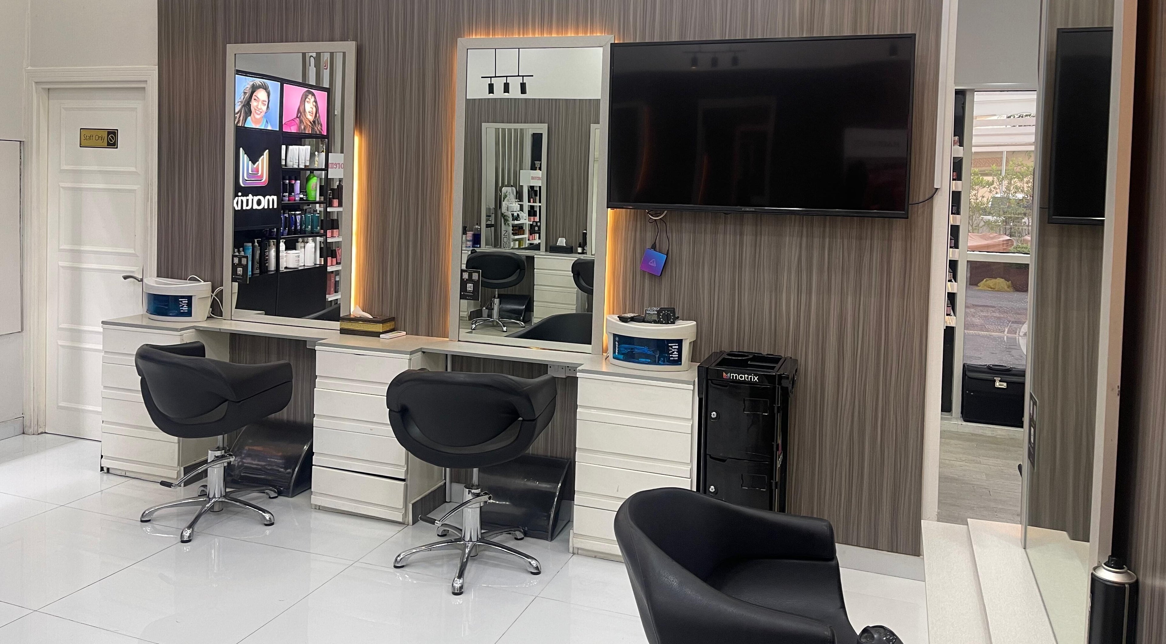 Elegant hair styling stations at Dreams Salon, Dubai, AE, showcasing modern design and comfort.