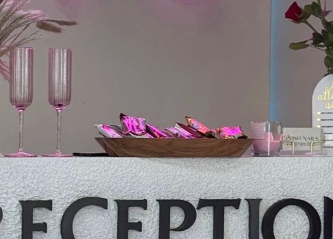 Elegant decor at Posh Nails Lurgan reception in Lurgan, Northern Ireland, GB with glassware and flowers.