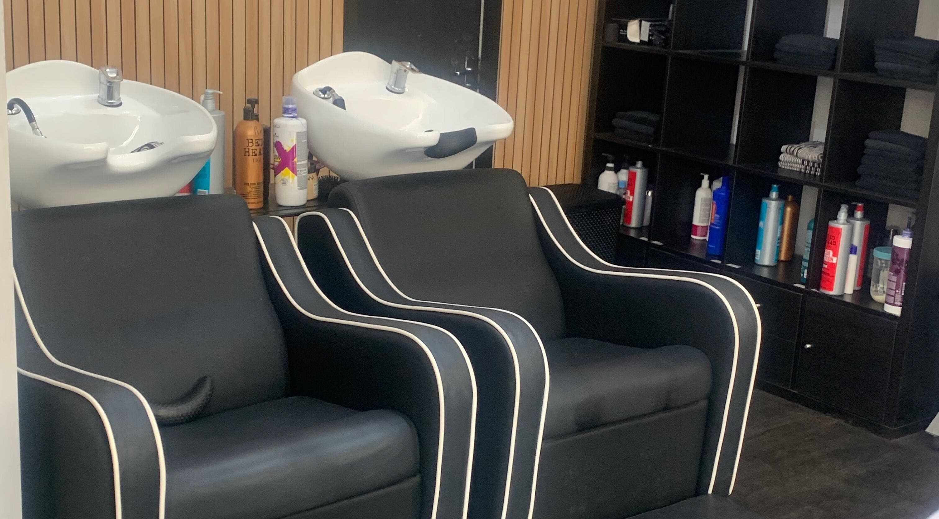 Modern salon wash stations at SC HAIRDESIGN, Liverpool, England, GB, showcasing luxury and style.