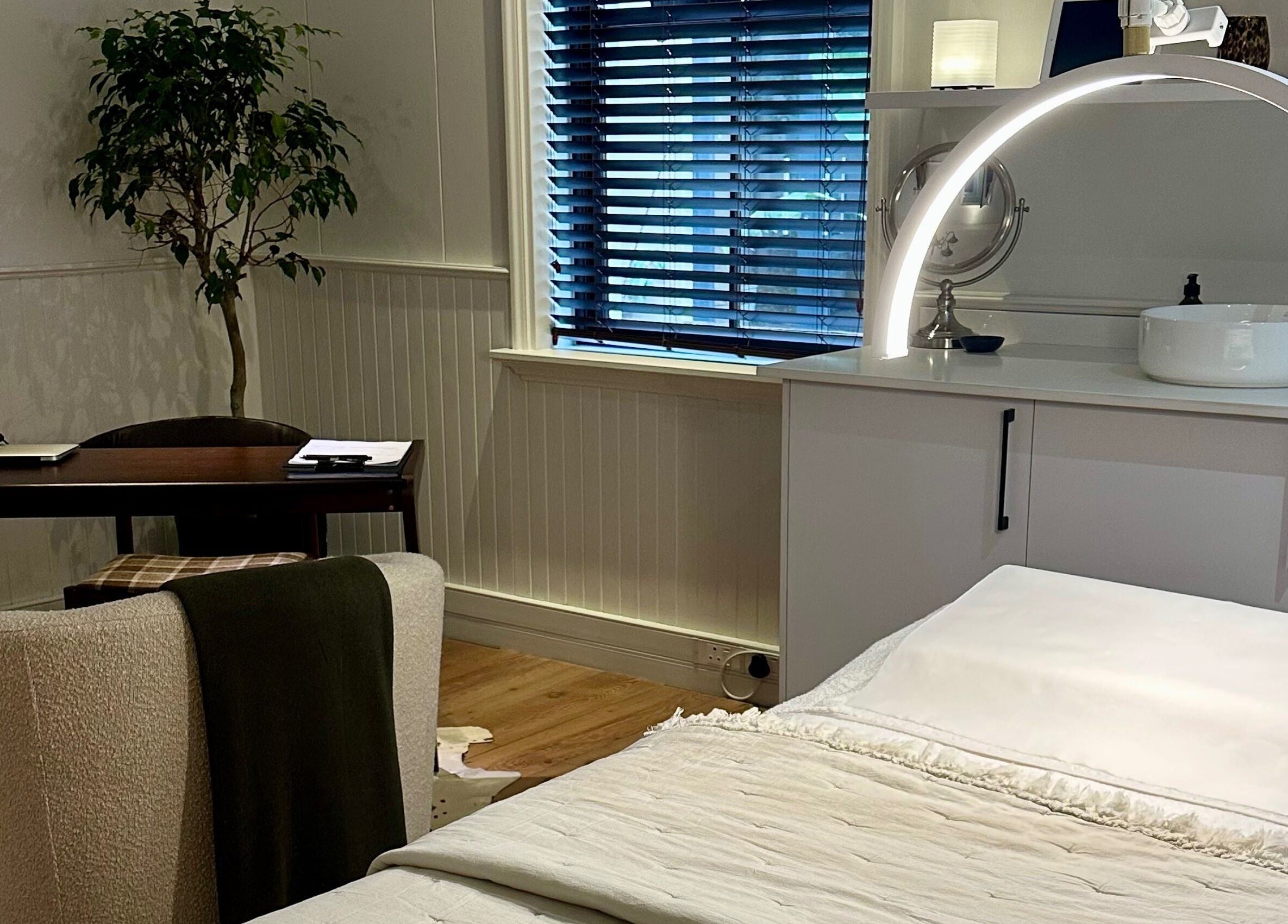 A tranquil treatment room at Pascale Dermal Aesthetics, Stellenbosch, Western Cape, ZA, featuring stylish decor.