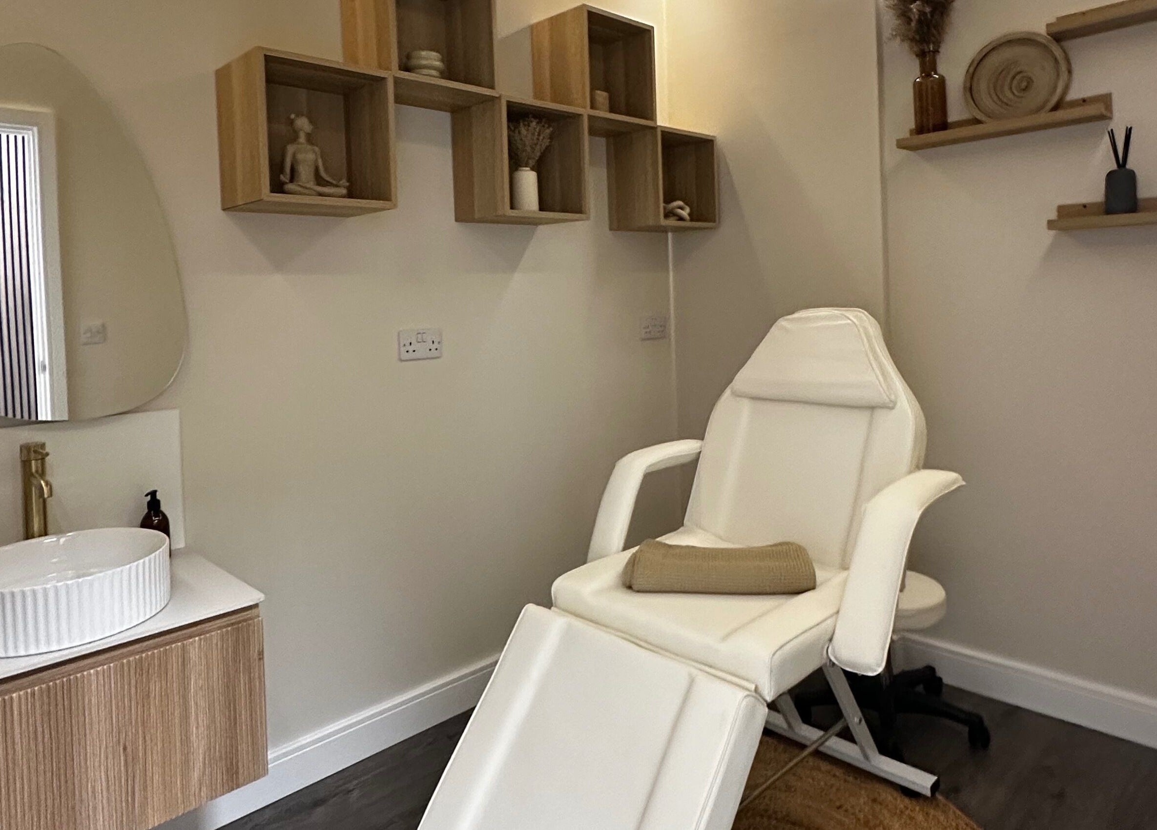 Relaxing massage room at Rituals Holistic Massage in Cardiff, Wales, GB with a comfortable chair and calming decor.