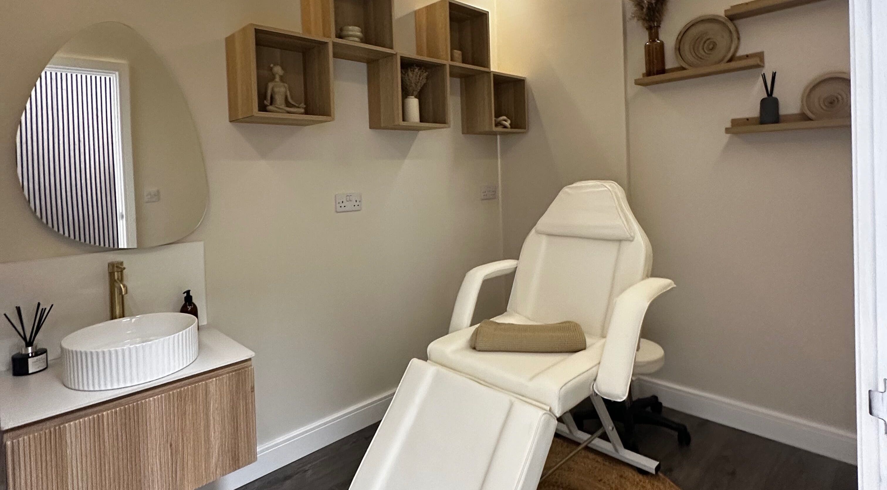 Relaxing massage room at Rituals Holistic Massage in Cardiff, Wales, GB with a comfortable chair and calming decor.
