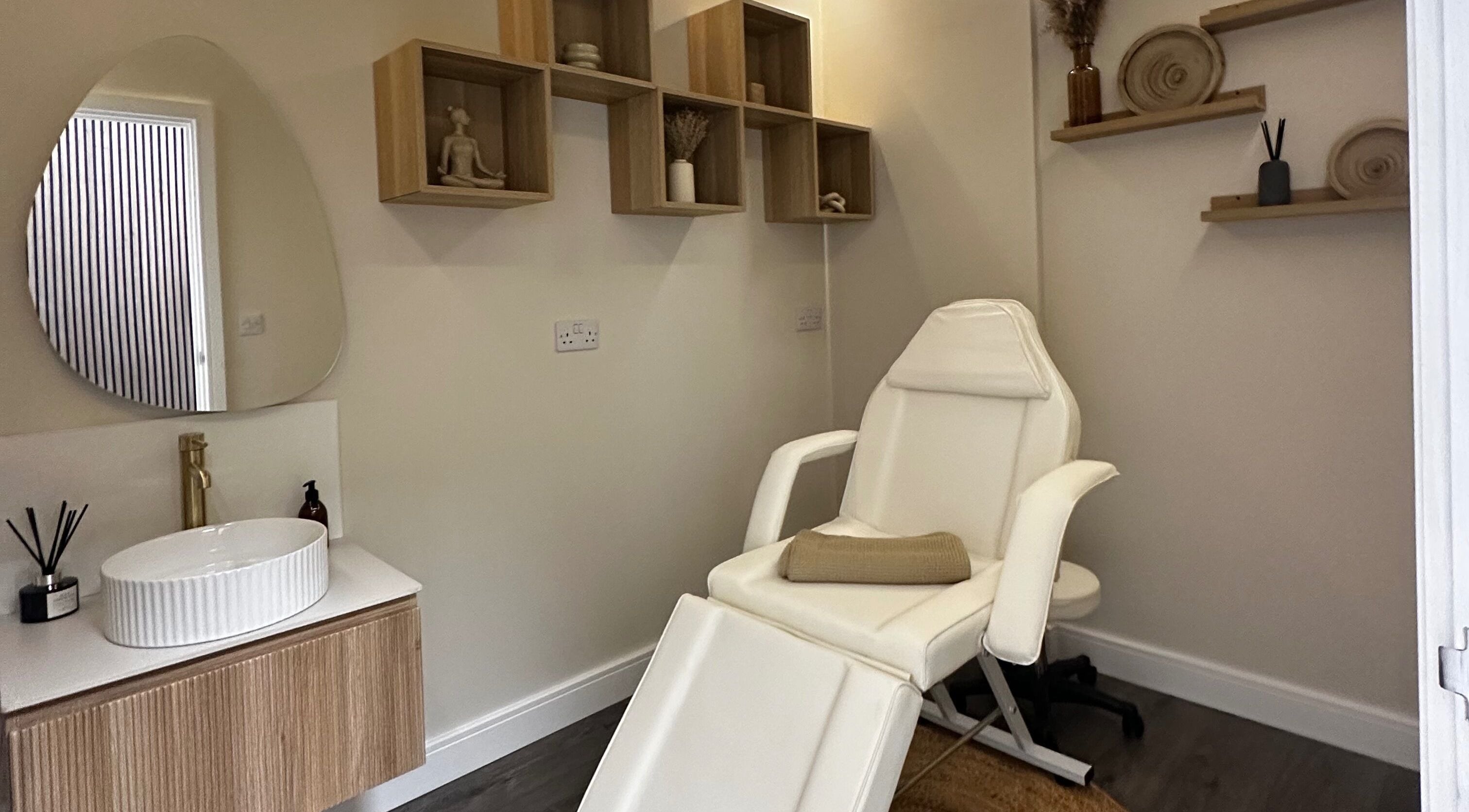 Relaxing massage room at Rituals Holistic Massage in Cardiff, Wales, GB with a comfortable chair and calming decor.