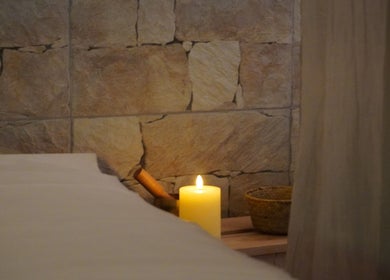 Cozy candle-lit spa setting at The Luxe Hair Spa in Barcelona, Catalunya, ES.