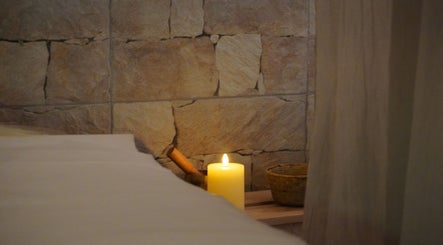 Cozy candle-lit spa setting at The Luxe Hair Spa in Barcelona, Catalunya, ES.