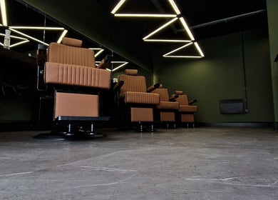 Modern barber chairs at BarberHouse44, Letterkenny, County Donegal, IE, showcasing sleek, stylish design.
