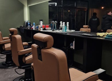 Elegant barber chairs at BarberHouse44, Letterkenny, County Donegal, IE, showcasing a professional grooming setup.