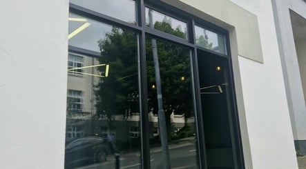 Glass facade of BarberHouse44 in Letterkenny, County Donegal, IE showcasing sleek design.