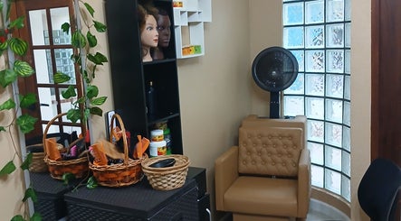 Cozy interior of Infinite Finesse by Chanel in Saint George's, GD, featuring styling tools and decor.