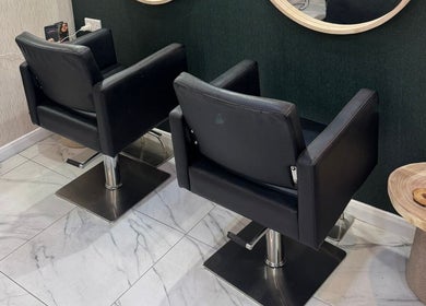 Elegant salon chairs at Alex Jamieson Hairdressing, Knottingley, England, GB create a modern and inviting atmosphere.
