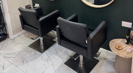 Elegant salon chairs at Alex Jamieson Hairdressing, Knottingley, England, GB create a modern and inviting atmosphere.