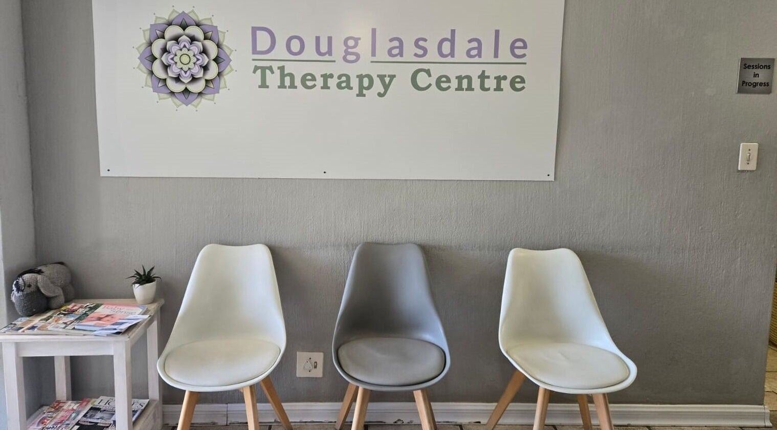 Calm waiting area with chairs and magazines at NIRA Holistic, Sandton, Gauteng, ZA.