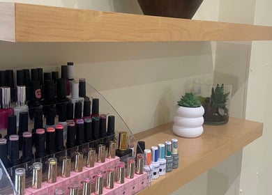 Nail polish selection at Nailsbyserenastrachan, Bathgate, Scotland, GB. Modern decor enhances elegant display.
