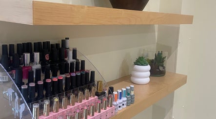 Nail polish selection at Nailsbyserenastrachan, Bathgate, Scotland, GB. Modern decor enhances elegant display.