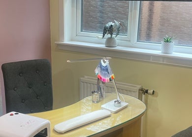 Chic nail station at Nailsbyserenastrachan, Bathgate, Scotland, GB with polish samples and elegant decor.