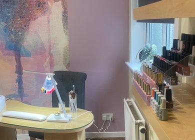 Nail salon interior with colorful polish display at Nailsbyserenastrachan, Bathgate, Scotland, GB.