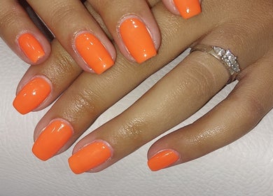 Vibrant orange manicure at Chloe Cross Nail Artist in Barnsley, England, GB.