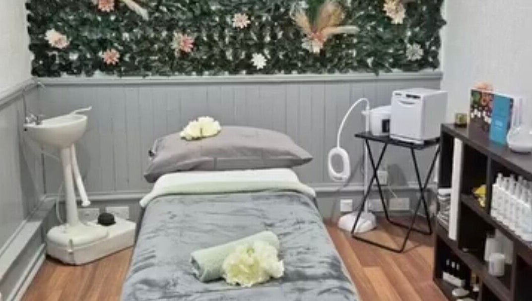 Peaceful treatment room at Simply Luxe Beauty, Coatbridge, Scotland, GB, with lush decor and cozy setup.
