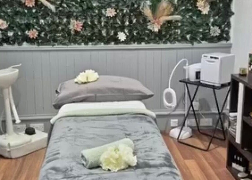 Peaceful treatment room at Simply Luxe Beauty, Coatbridge, Scotland, GB, with lush decor and cozy setup.